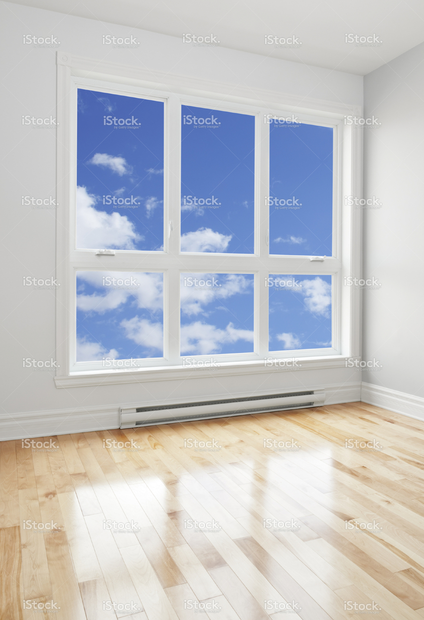stock-photo-22570321-empty-room-and-blue-sky-seen-through-the-window